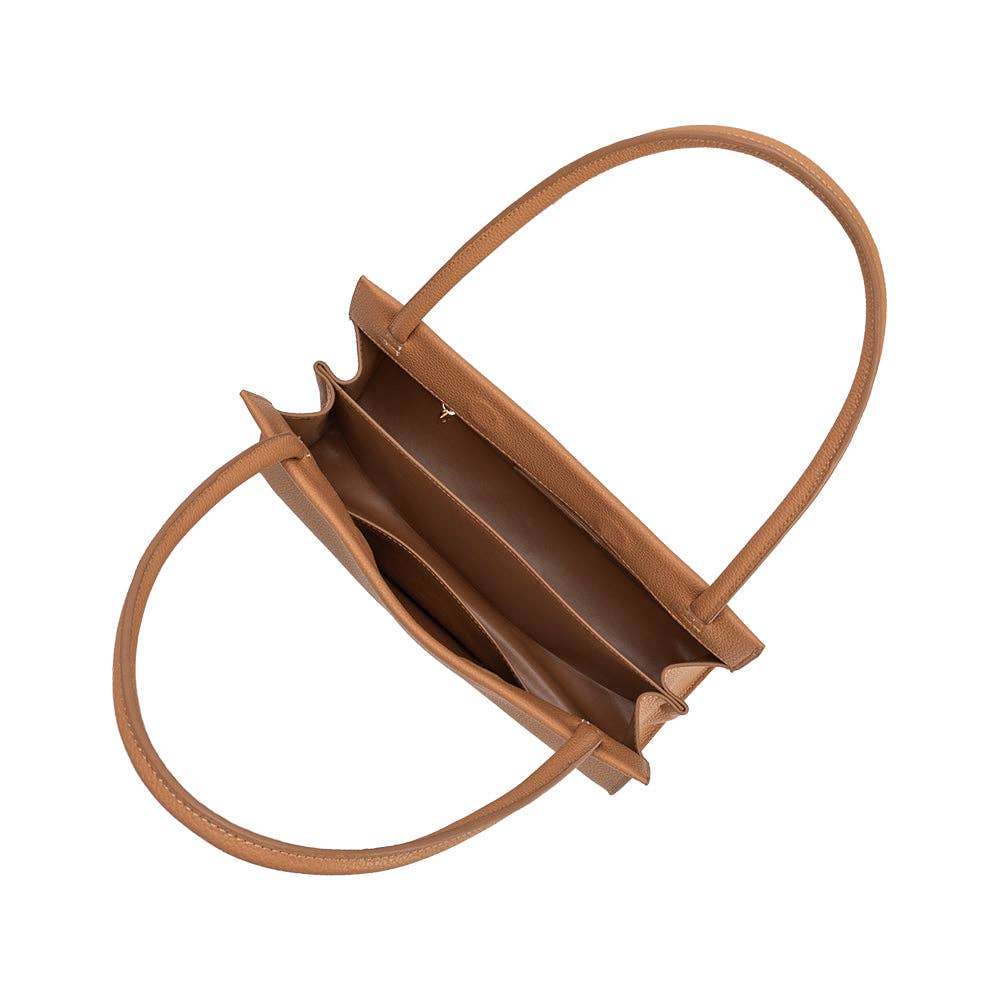 Brown handbag with a circular handle on a white background