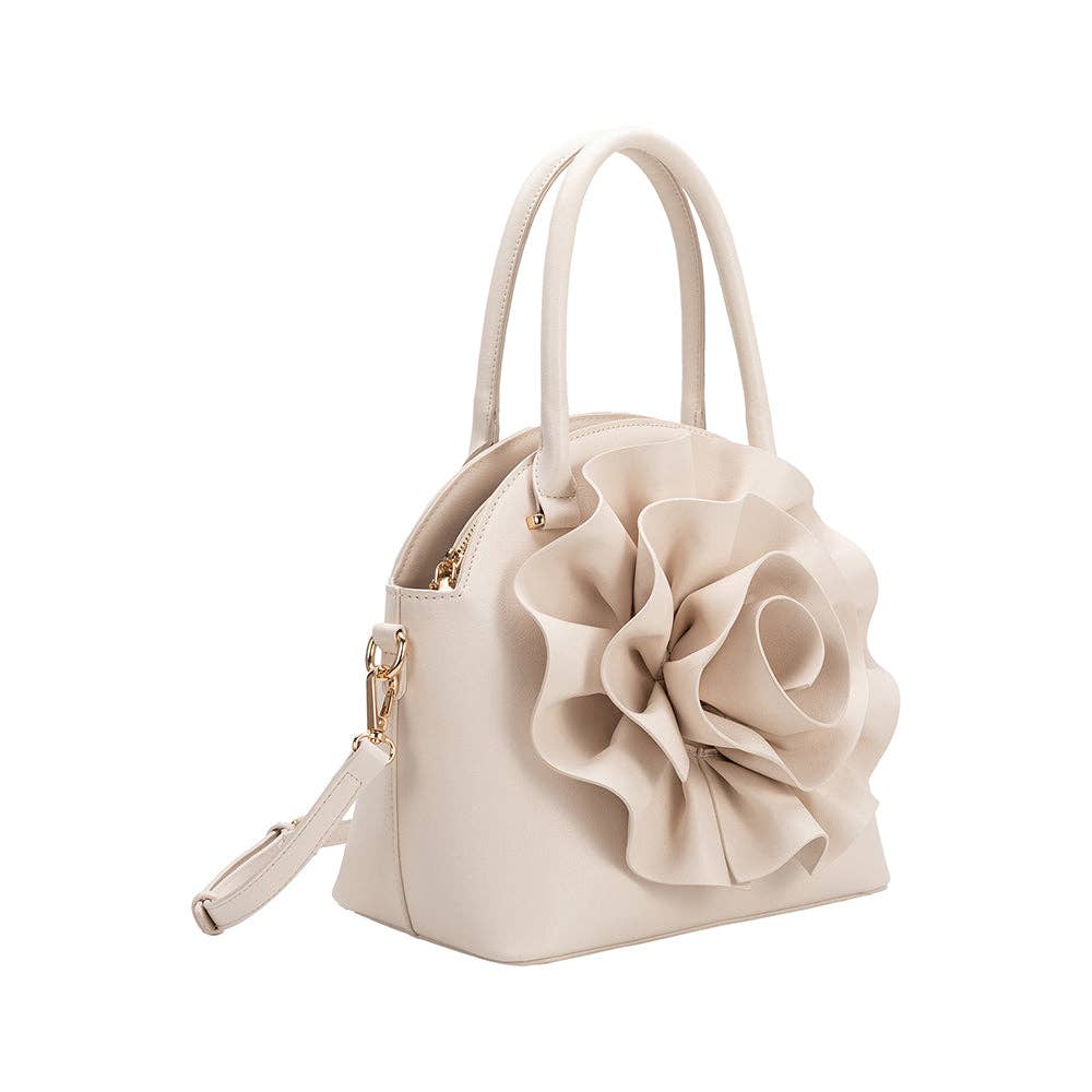 side view of ivory handbag with large flower detailing and crossbody strap on white background