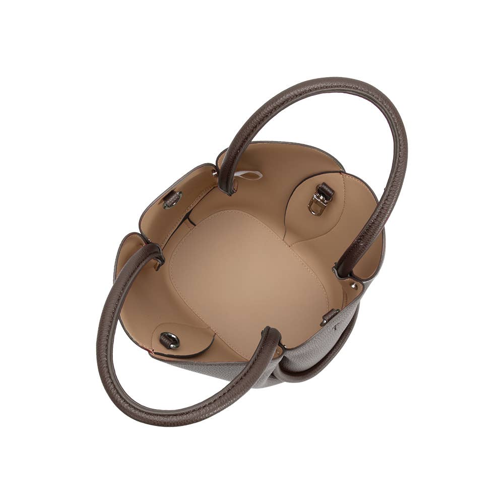 Tan handbag with brown handles on a white background
