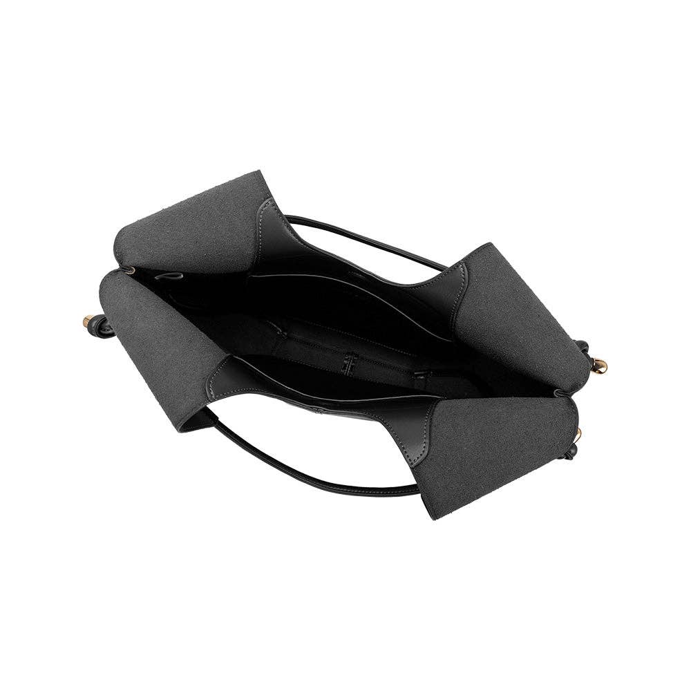 Interior of black leather shoulder bag with knotted design and gold hardware on the handles.