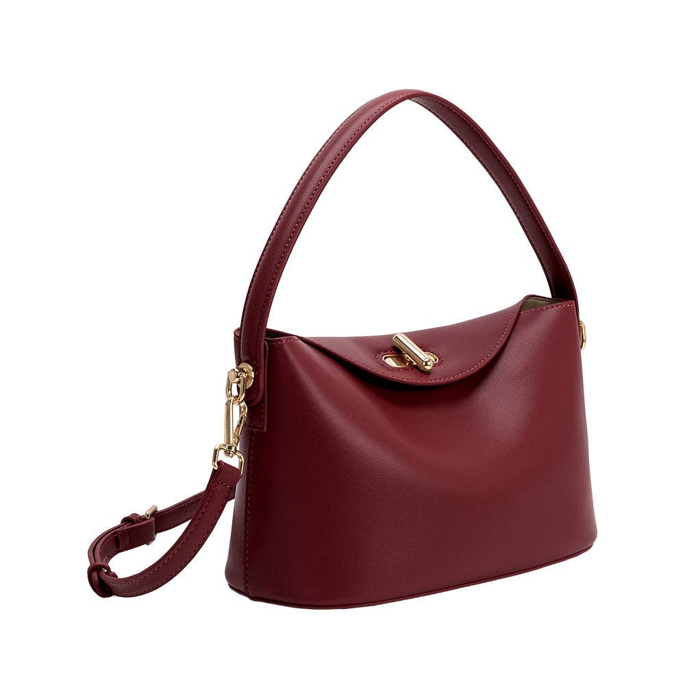 Maroon handbag with gold accents on a white background