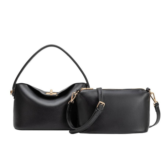 Black handbag with gold accents on a white background