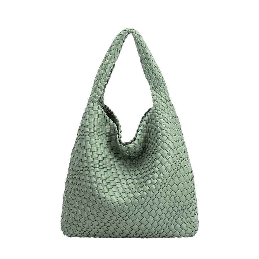 Mint green woven handbag on a white background