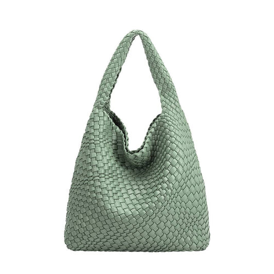 Mint green woven handbag on a white background