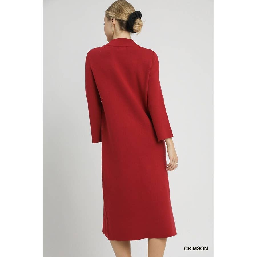 Woman wearing a red midi mock neck knit dress on a white background