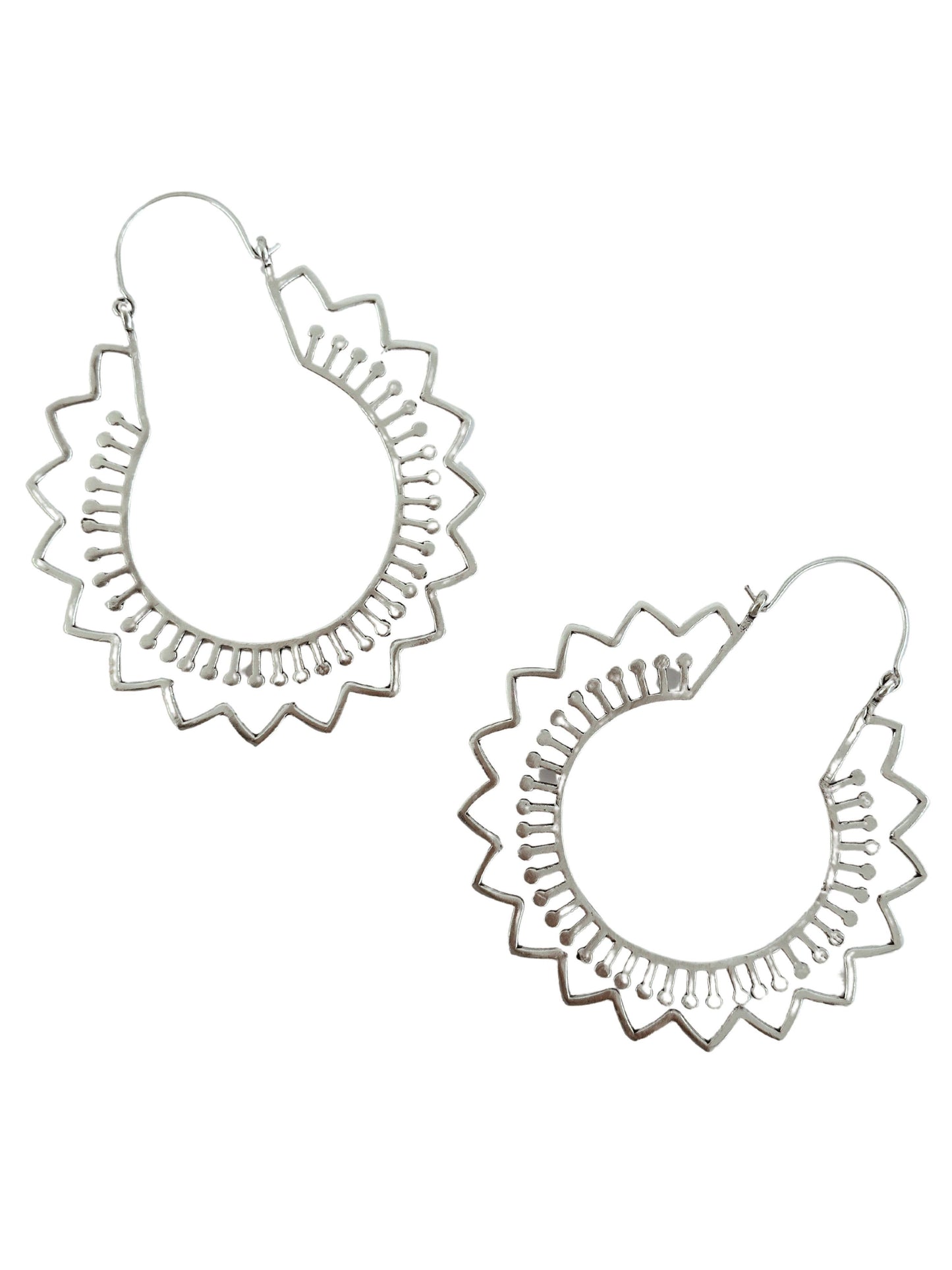 Silver plated hoop earrings with stylized flower detail shapes. on a white background.