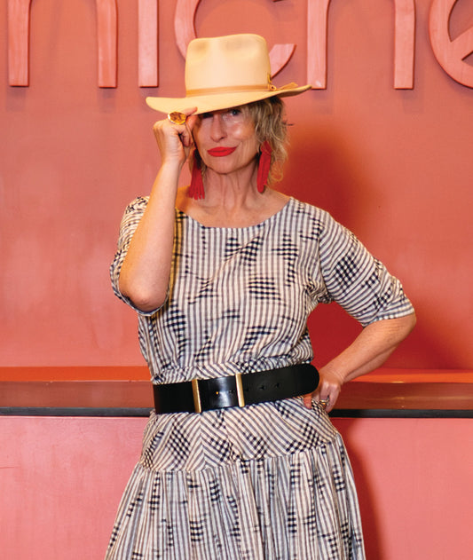 model in a grey plaid top with a matching skirt