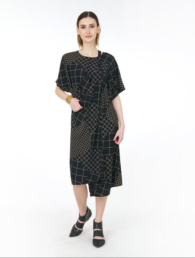black grid print dress with a connecting strap to style in multiple ways