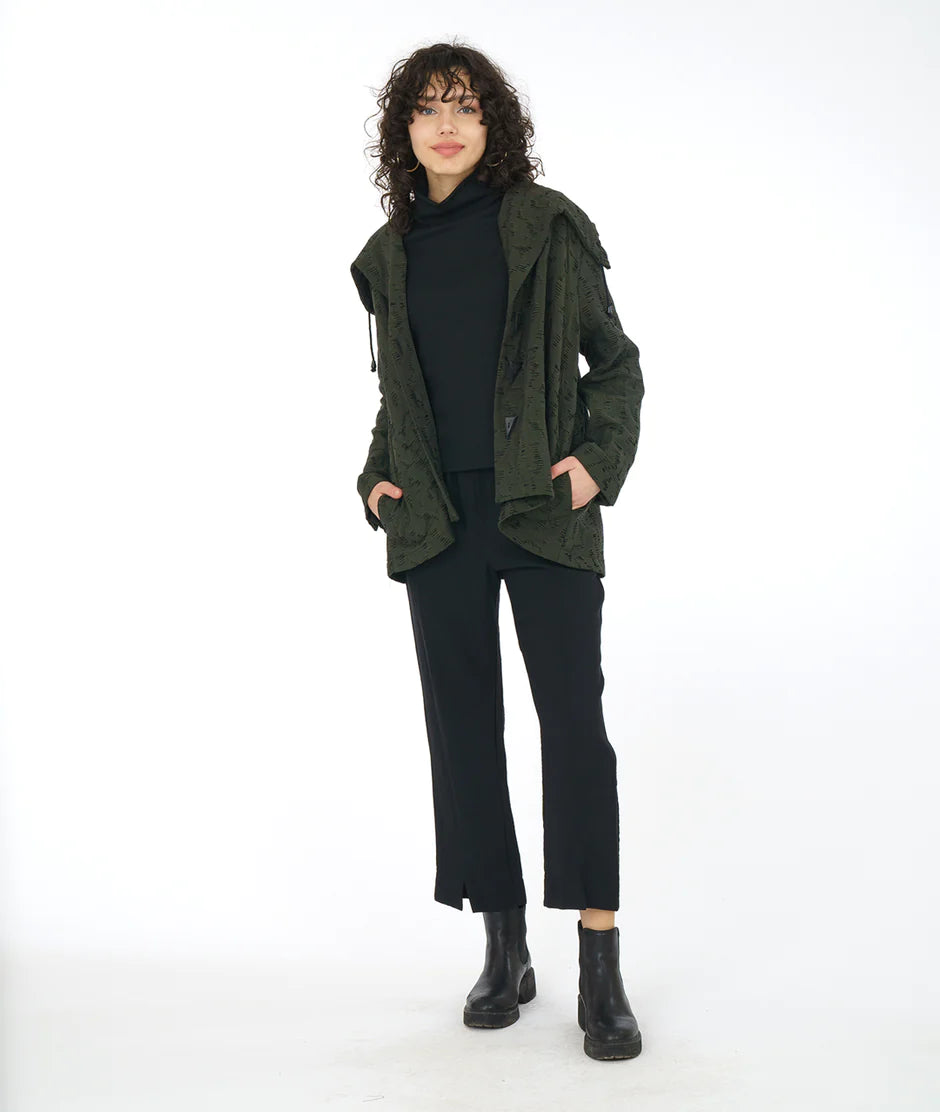 model wearing olive green jacket with all black underneath