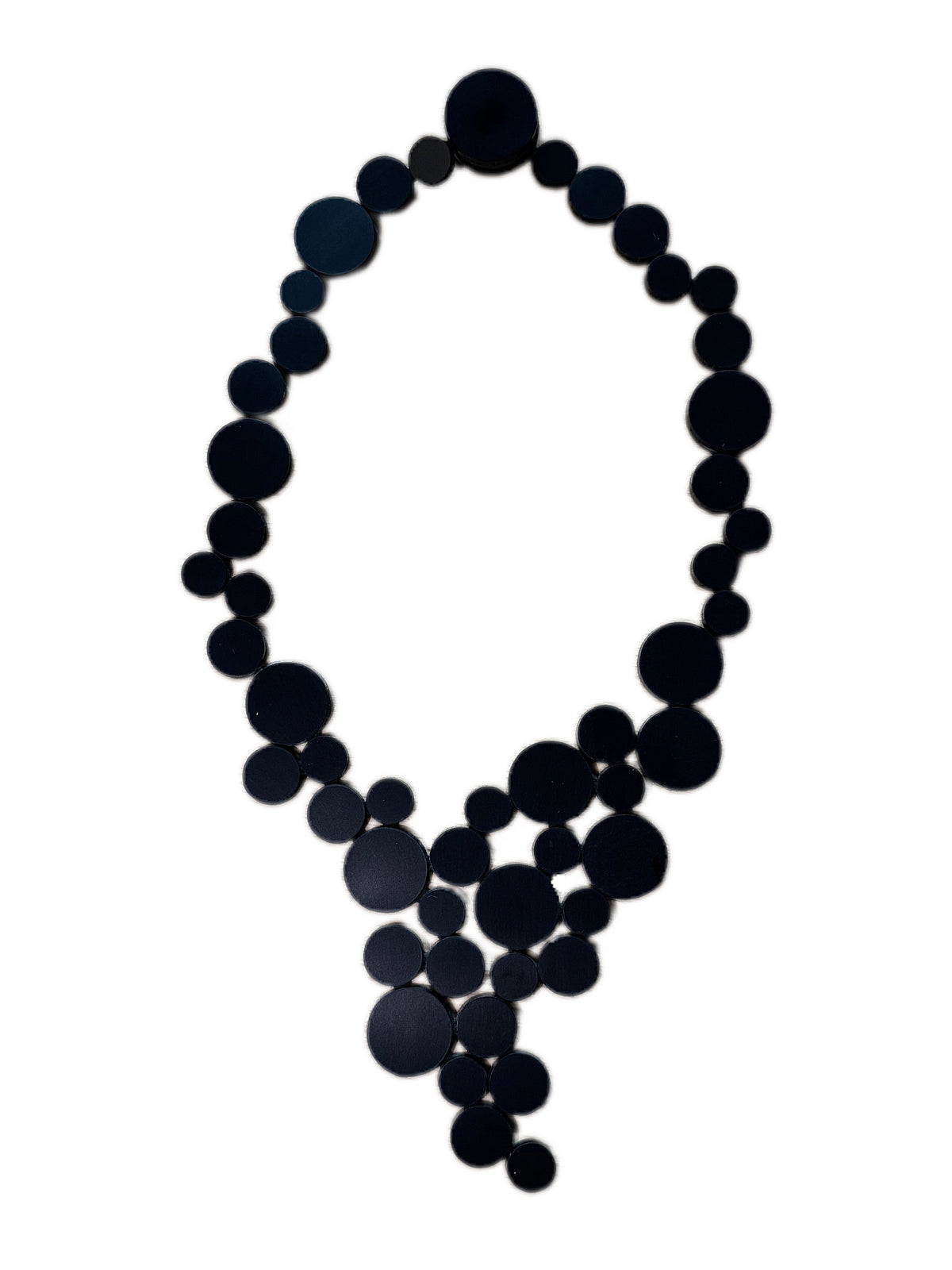 Black circle cluster necklace against white background