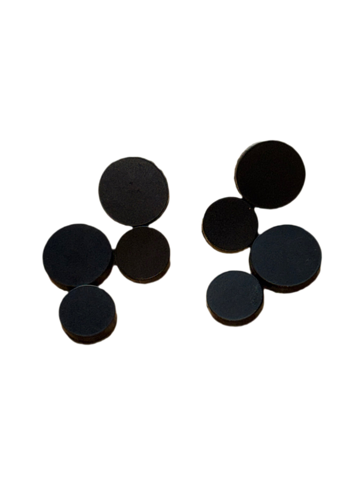 black circle cluster earrings against white background