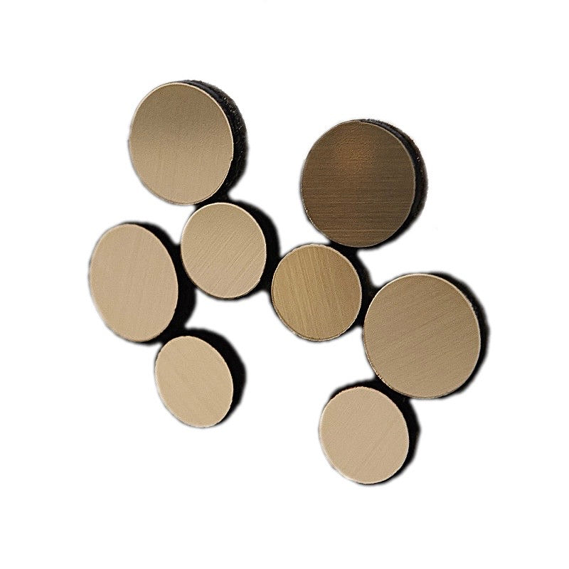 Gold circle cluster earrings against white background