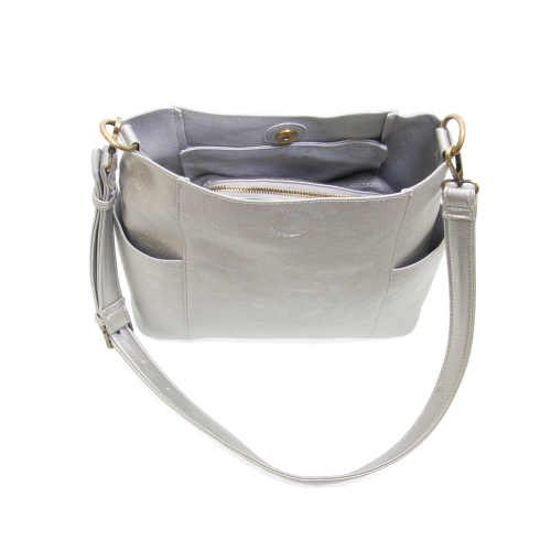 top view of silver vegan leather bag with pockets on each side and shoulder strap