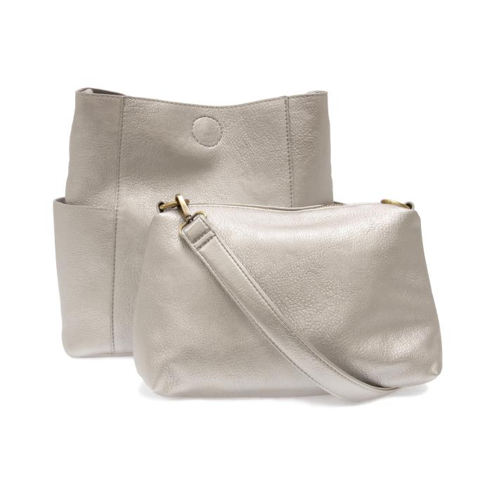 silver vegan leather bag with pockets on each side and shoulder strap with removable bag