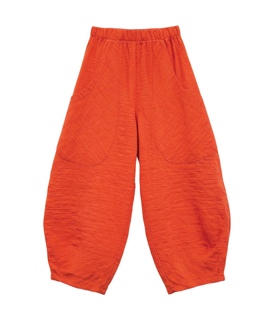 coral orange textured wide leg pant with oversized pockets, tapered ankles and an elastic waistband