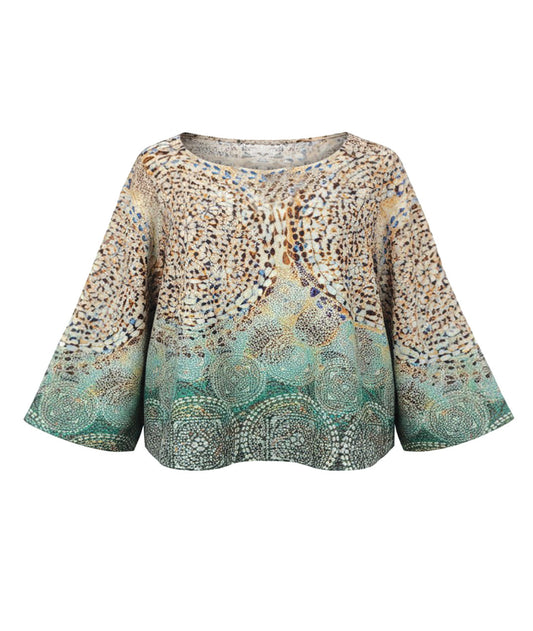 Colorful patterned blouse on a white background