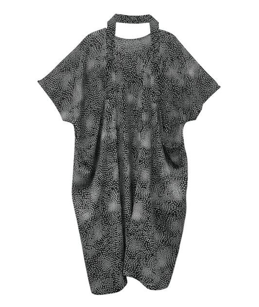 Black and white patterned dress with a connecting strap for styling options. shown on a white background