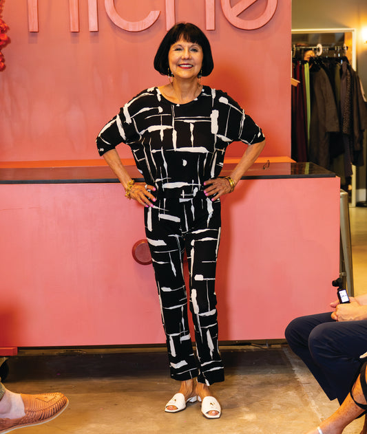 model wearing black and white print pullover top with a round neckline, 3/4 sleeves, with matching straight leg pants 