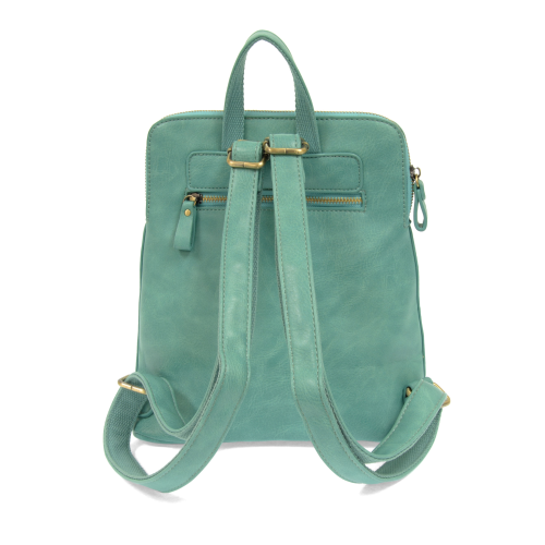 back of light teal colored backpack