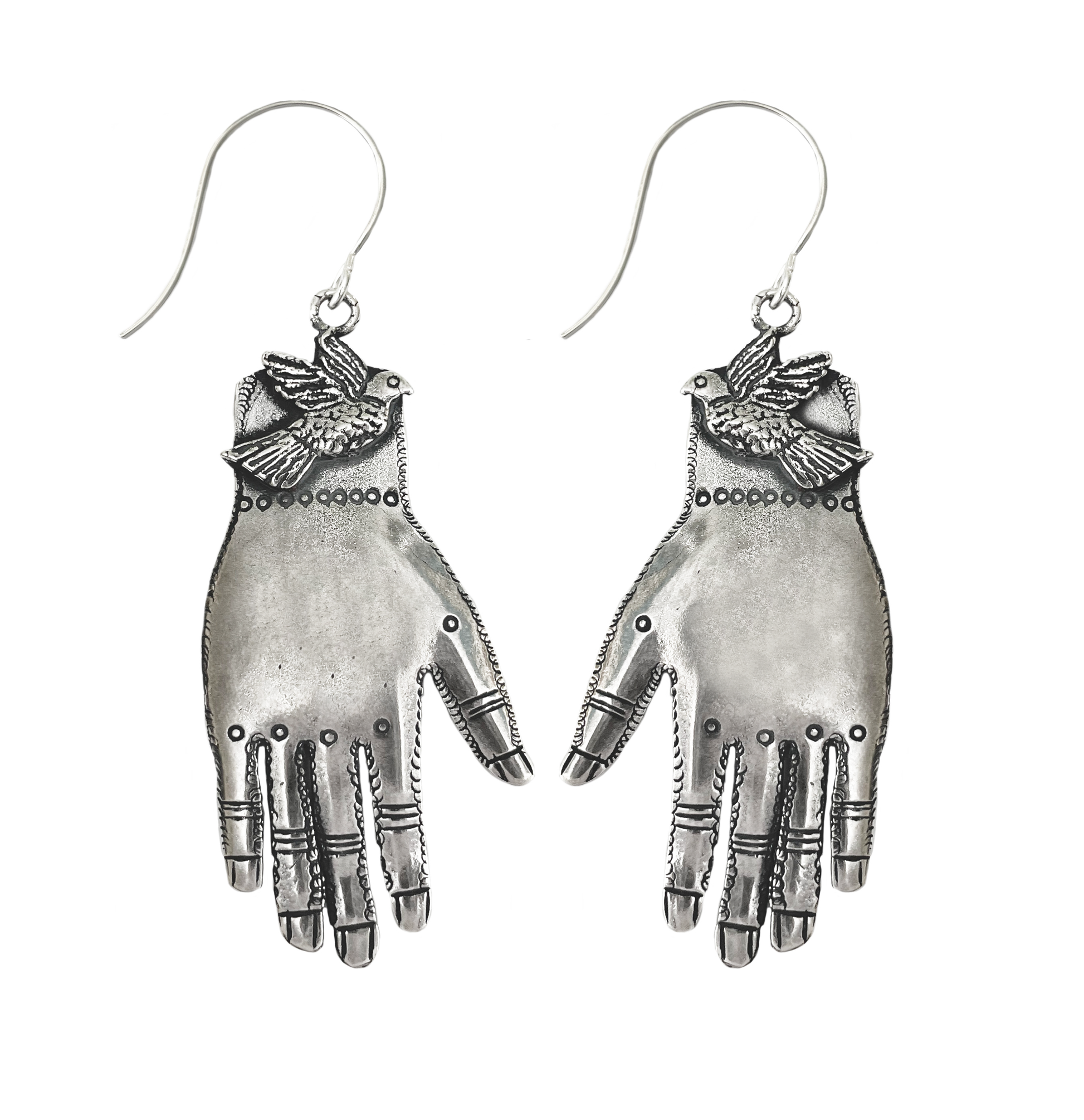 Silver-plated bronze earring with hand and bird on white background.