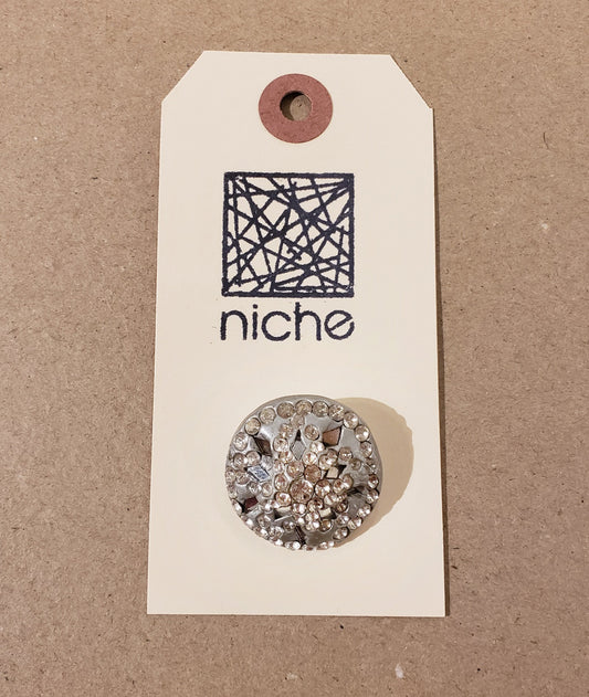 silver rhinestoned button on a Niche card