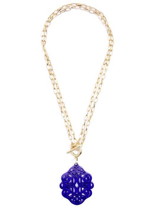gold chain necklace with blue abstract pendant