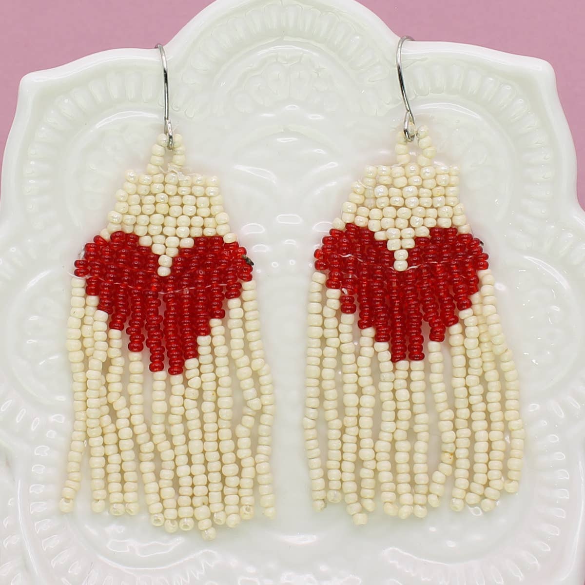 White beaded fringe earrings with a big heart