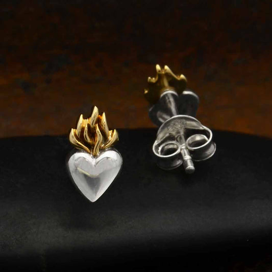 Silver heart with bronze flame at top, stud earrings on dark background. Post is silver too