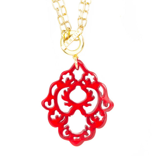 red abstract pendant on a gold chain