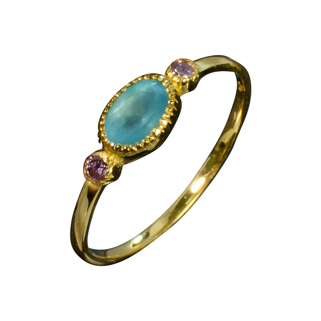 vermeil ring with on large blue stone with two small purple ones on the side of it