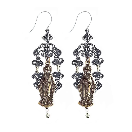 Close up of dangle earrings with hook, silver floral scrollwork and bronze virgin mary icon. small pyrite drop bead at the bottom. On a white background.