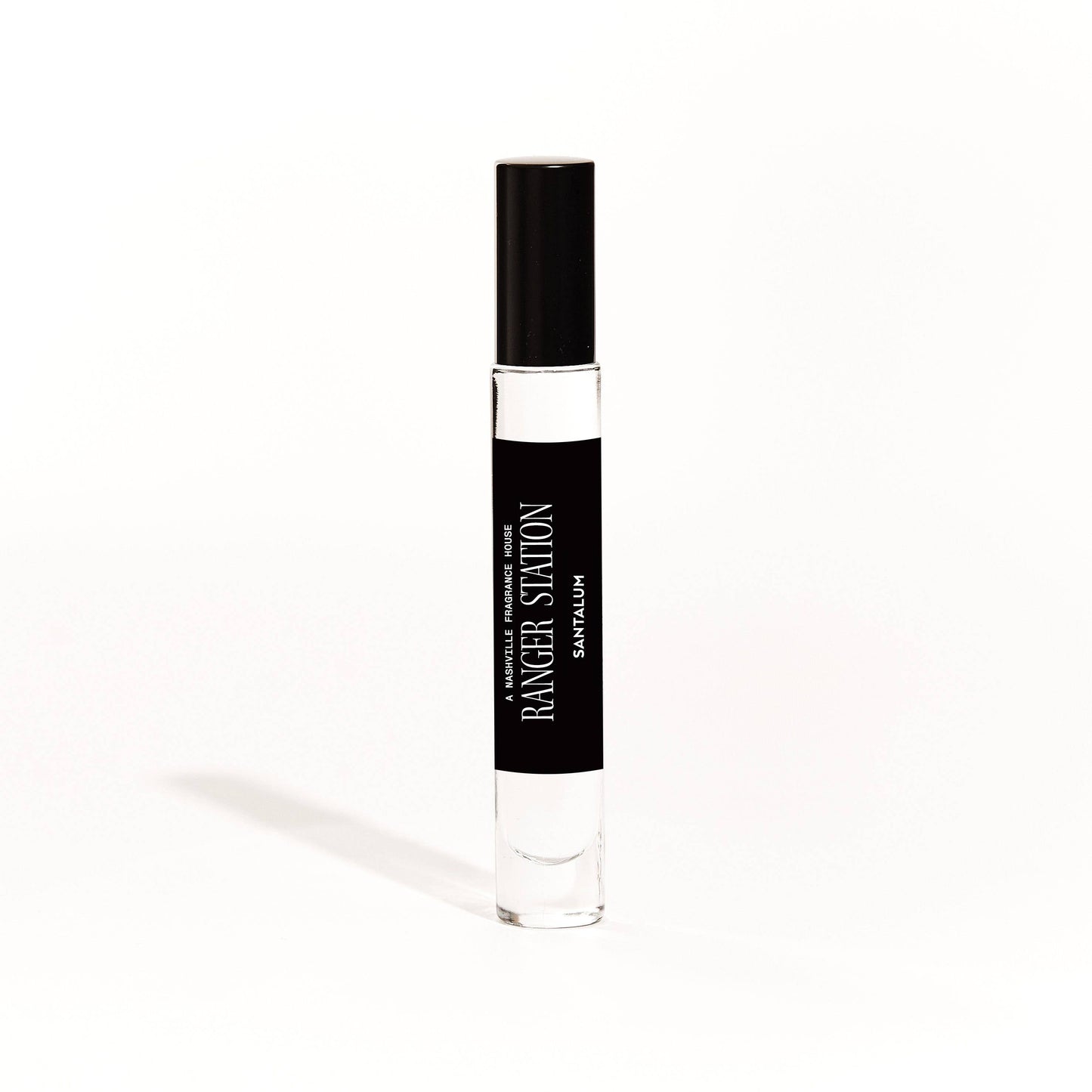 A 10ml bottle of unisex perfume with a black spray top and a label that reads 'RANGER STATION Santalum'.
