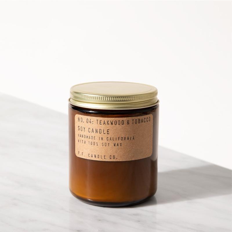 candle in an amber colored jar