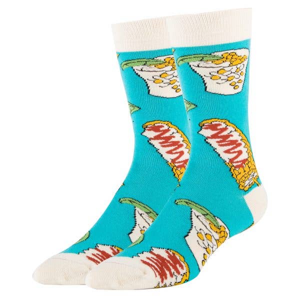 Featured against a white background are blue crew cut socks that have white at the toes, heels, and top of the sock. There are elotes and corn in a cup featured throughout the sock.