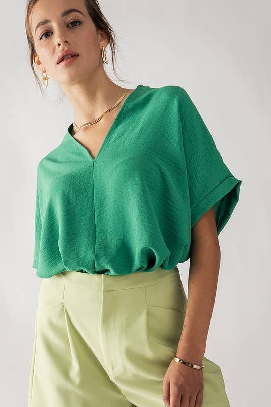 Model wearing an oversize V-neck Green colored Top