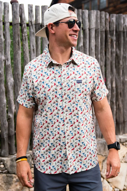 male model wearing a patterned golf shirt