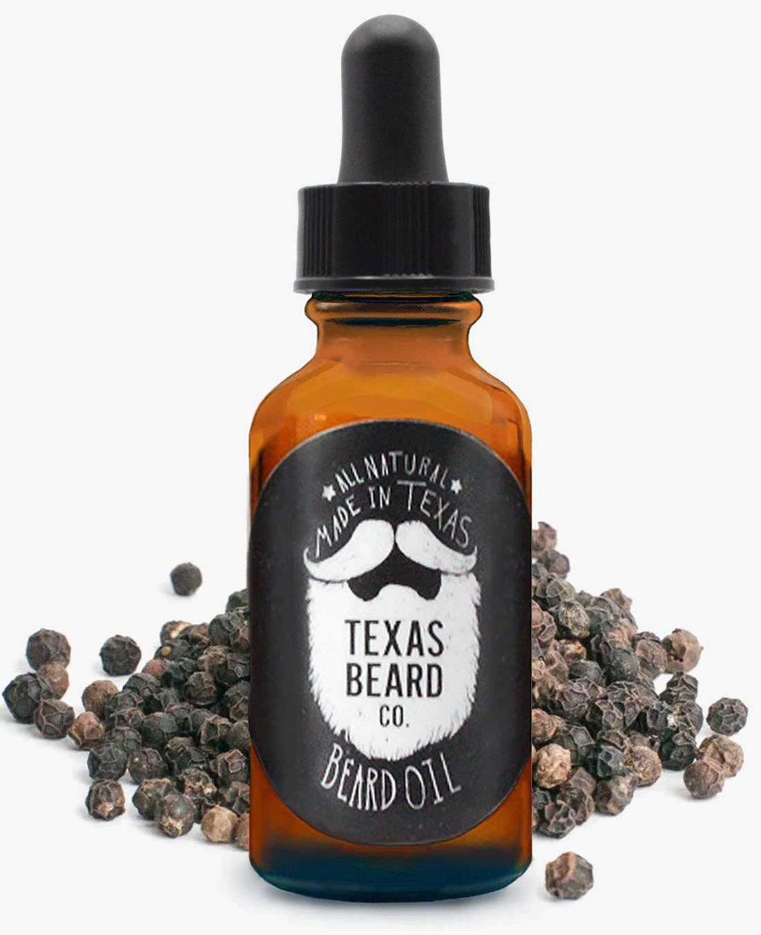 black pepper beard oil in front of peppercorns