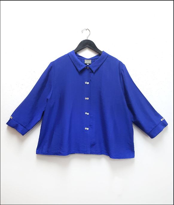 cobalt blue button up blouse on hanger with white background