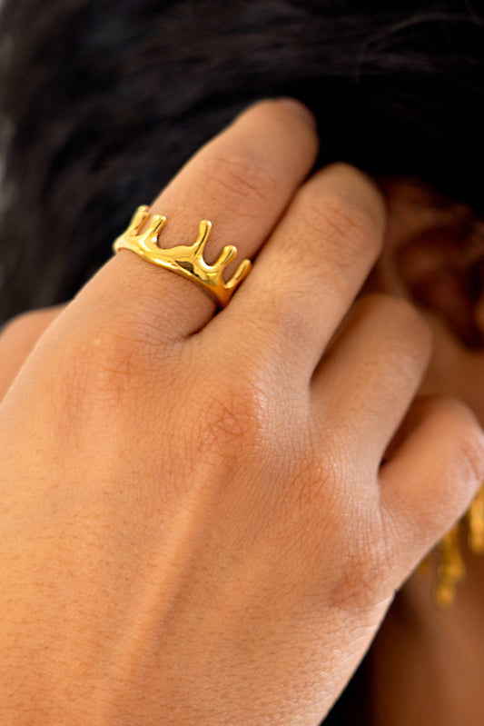 model is wearing a dripping gold ring