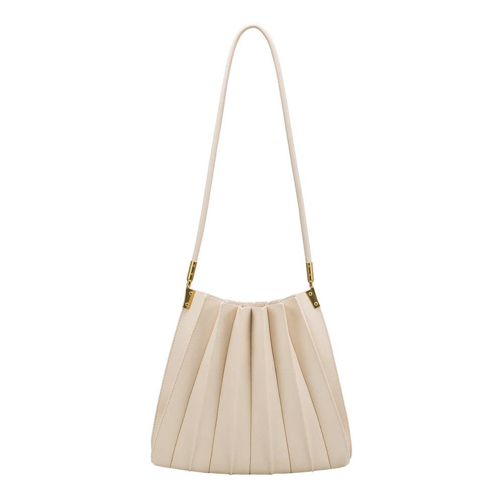 ivory pleated purse against white backdrop