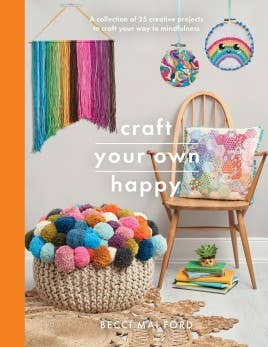 cover of book entitled "craft your own happy" with crafting supplies in the background