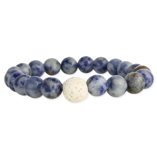 Close up of a round bead bracelet against a white background. Beads are blue multi tone with a single porous cream stone in the center.
