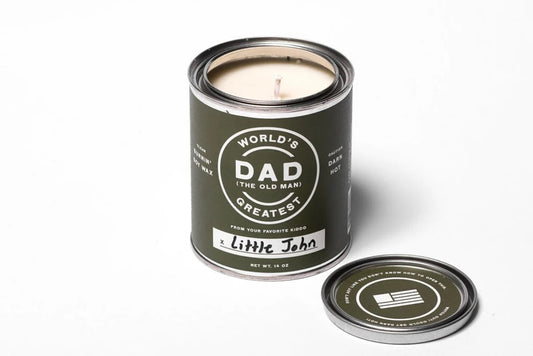 candle with "dad" on the label. in a small paint can. on a white background