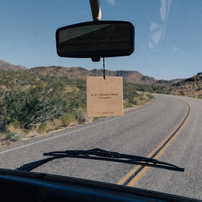 air freshener hanging from the rear view mirror of a vehicle