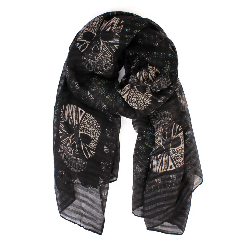 close up of black scarf with cream color skulls against a white background